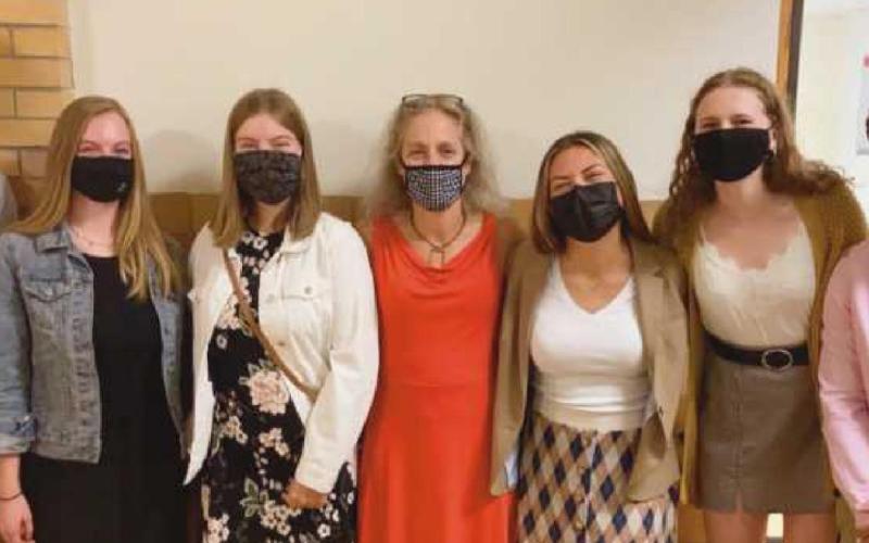 Students presented their idea for a new club during the school board meeting. Shown here with their English teacher Amy Farrar, middle, they are, from left, Will Kleeberger, Emma Olin, Abigail Ludwig, Bella Aromas, Lindsey Lazor and Owen Laib. Not pictured: Kacey Laumann, Olivia Achenbach and Leah Morris.