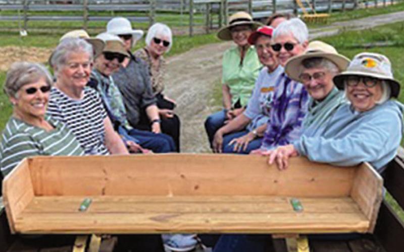 New Century Club members take a wagon ride to see bison.