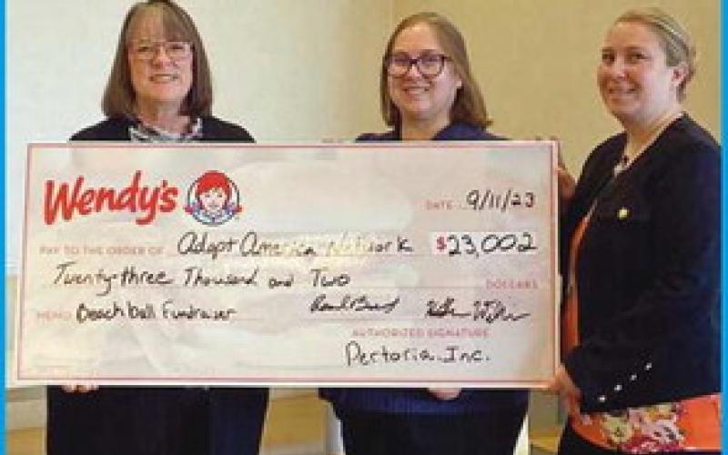 Perrysburg Wendy’s presents check to Adopt America Network
