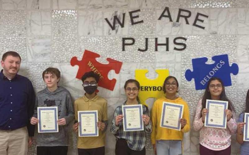 From left are Corbin Brangham, seventh grade science teacher, with Perrysburg Junior High School students AJ Benko, Avnish Shenge, Krisha Raichura, Maanya Parikh, Ria Khatri and Gauri Anil.