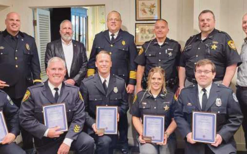 Standing are members of first response teams in Perrysburg and the township. Front row, from left, award recipients Jordan Gregory, Chris Klewer, Chad Hartman, Katie Cooley and Ryan Helwig.
