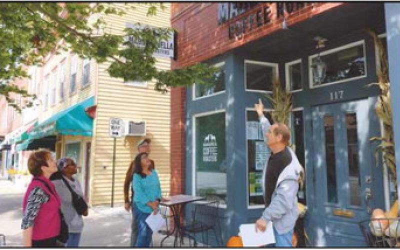 On September 17, Way Public Library Local History Librarian, Richard Baranowski, led an uptown building tour of the 100 block of East Louisiana Avenue. He shared information about building origins and different businesses over the years. Pictured, from left are: Alicia Lipinski, Burma Stewart, Peggy Glunk, Bill Glunk and Mr. Baranowski.