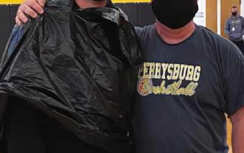 Pictured at right: Scott Buker, assistant principal, left, and Don Christie, principal, right.