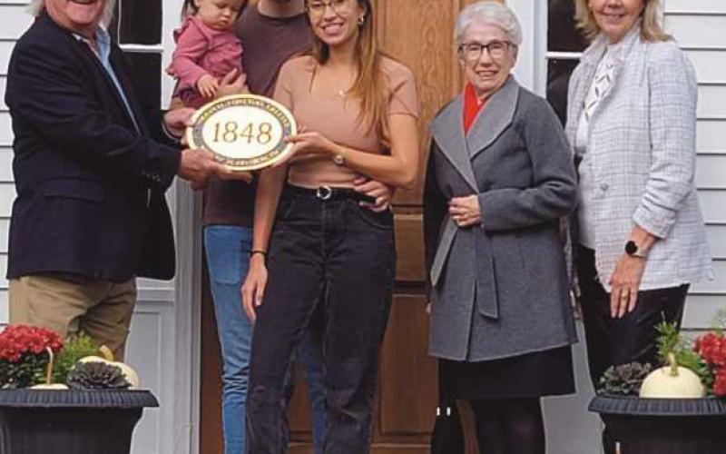Daniel and Teresa McCartney of 517 East Sixth Street received a plaque from Historic Perrysburg Inc. members, from left, Dave Kleeberger, Mary Smith and Joy Studer. The home was built in 1848.