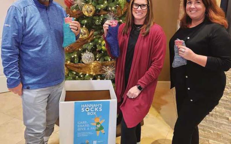 Citizen Advisory Group team members wearing crazy socks to kick off the sock drive.