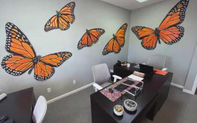 Offices at the center feature monarchs.