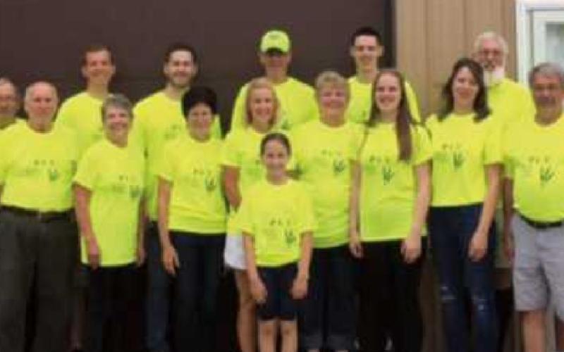 Volunteers worked at the PCU food pantry on June 26 to reorganize and restock the shelves.