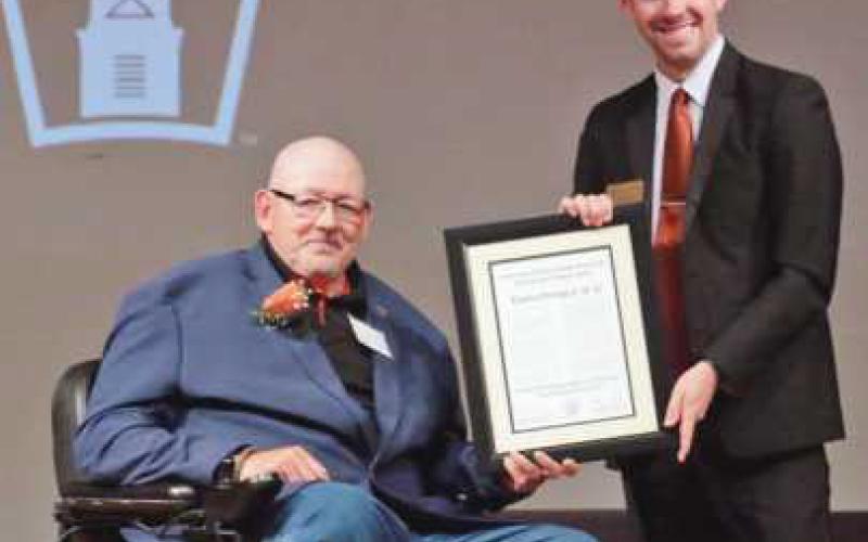 Thomas Brungard, left, was recognized with the Distinguished Alumnus Award by Sam Yates, of Findlay, president of the Alumni Board of Governors.