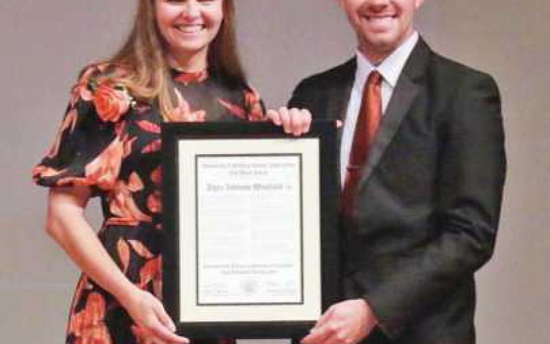 Alyse Johnson Wineland received the Old Main Award from Yates during the University of Findlay Homecoming celebration.