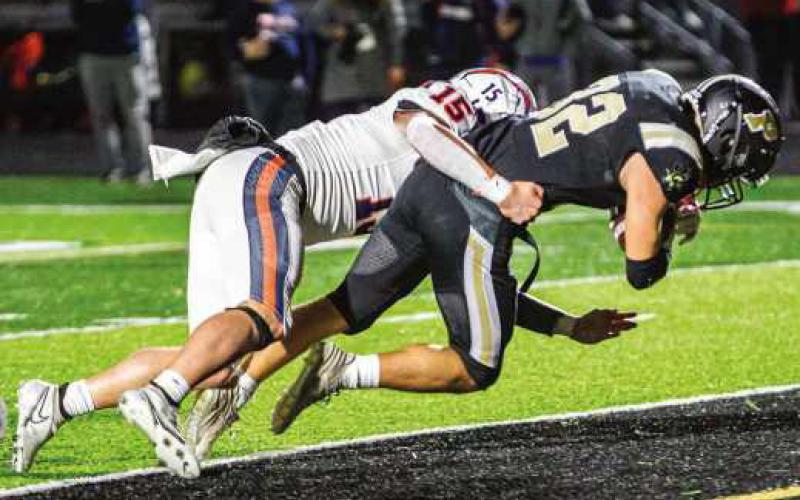Senior running back Joe Seney scores for the Jackets.