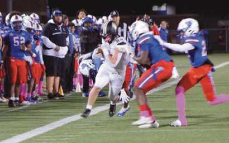 Tight end Zach Schroeder scampers along the sideline for a big gain.
