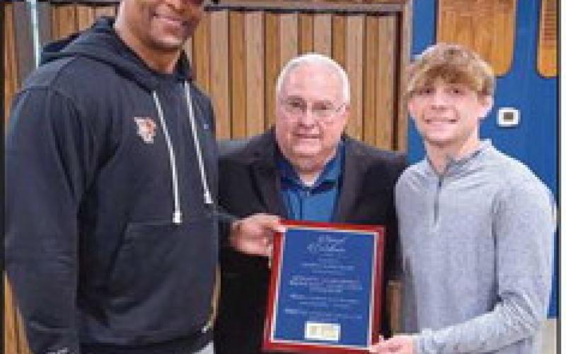 From left: Coach Eddie George, Freedom Township Men’s Club Representative Rick LaLonde and Marcus Blaze.