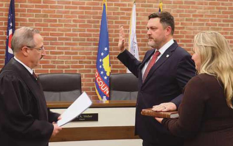 Judge Aram Ohanian swore in returning council member Kevin Fuller.