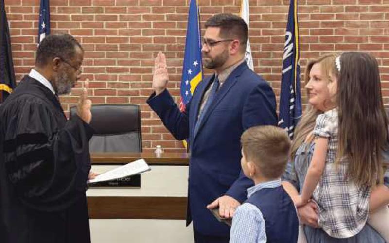 Judge Myron Duhart swore in newly-elected Justin Edgell.