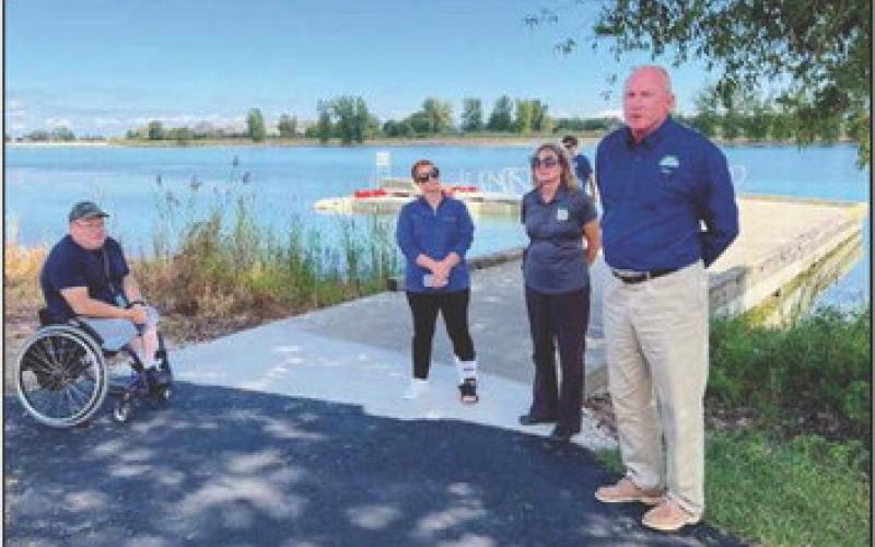 At the unveiling are Gary Peters of west Toledo; Stephanie Merkle, Columbia Gas; Lisa Daris, OSPF and Glen Cobb, ODNR.