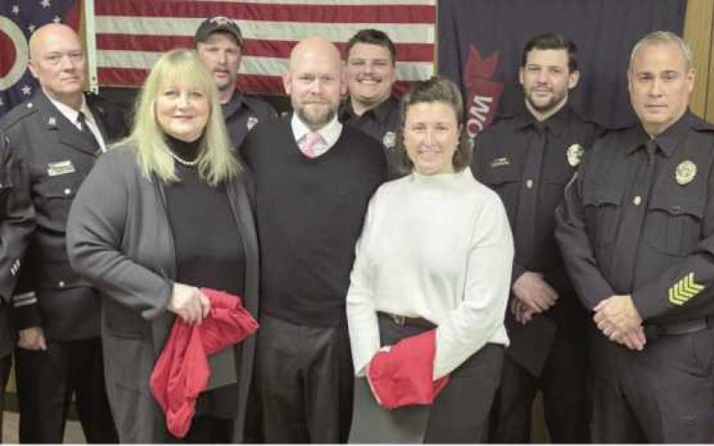 Back from left: Firefighter Todd Hager, Fire Captain Paul Weist, Firefighters Branden Abke and Sam Eiben, Police Sergeants Tyler Gearig and Scott Mezinger and Police Patrolman Andrew Watson. Front from left: Awardees Sarai Shaneck, Justin Bytner and Samantha Bytner.