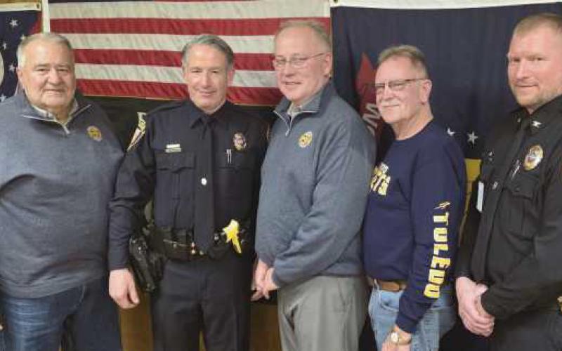 From left: Trustee Joe Schaller, newly appointed Deputy Police Chief Jason Gladney, Trustees Bob Mack and Gary Britten and Police Chief Matt Gazarek.