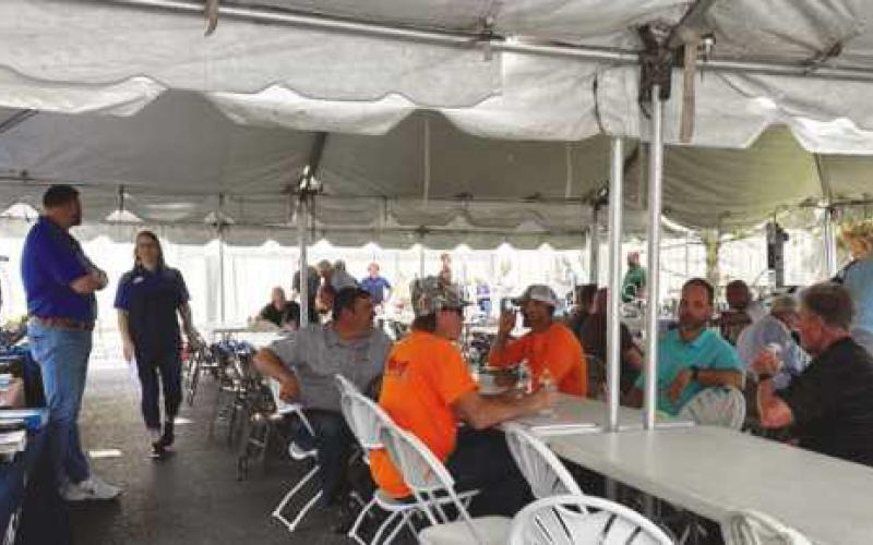 Contractors and customers enjoy a meal together in the parking lot of Maumee Supply at their “Lunch with the Pros.”