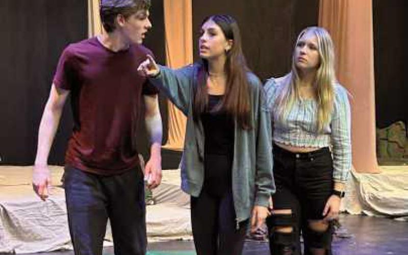 Student actors practice bringing the musical to life.