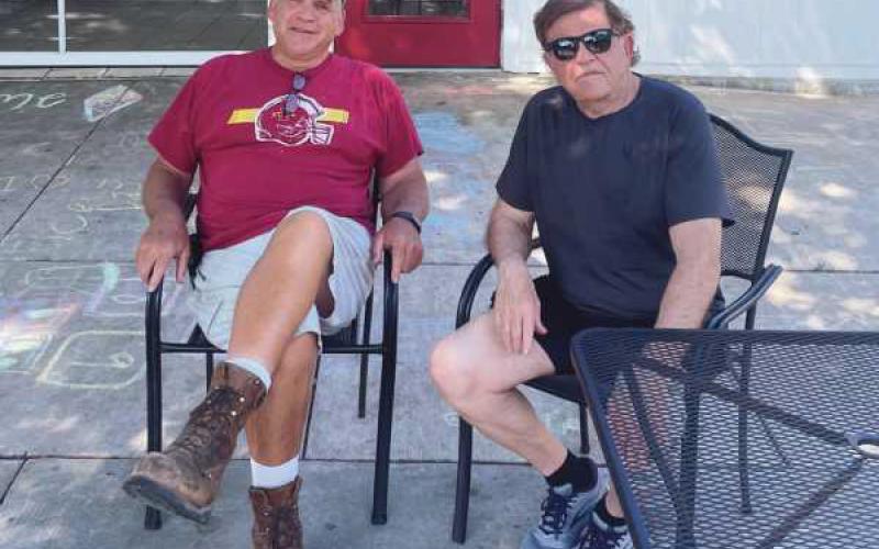 From left, O-Deer Diner owner Rick Ruffner and former NFL coach Jerry Glanville stay cool in the shade in front of the ice cream shop. It was recently announced that O-Deer Diner will be sold after 15 years of business, following Ruffner’s decision to retire. See something around town that other Perrysburg Messenger Journal readers might find interesting? The staff invites readers and advertisers to submit photos by email to editor@ perrysburg.com, and they may be featured in the paper.