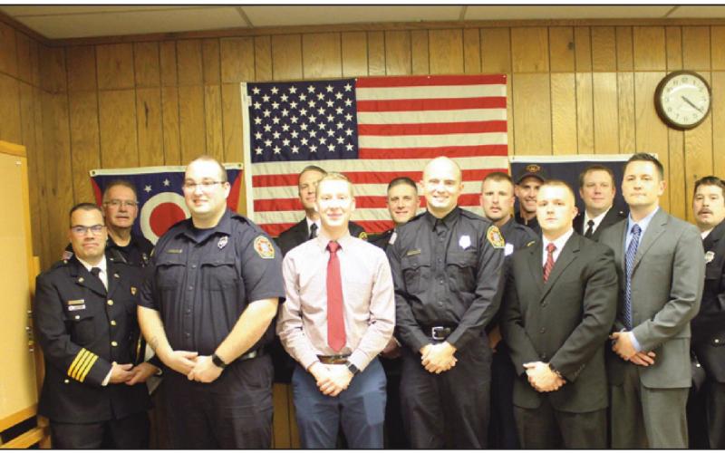 On December 15, five personnel were sworn in to serve the Perrysburg Township Fire Department. They are front row from left, Brian Perkins, Jacob Rands, Joe Gernheuser, Jaren Wickham and Levi Kuebler. Behind them are members of the department and they are flanked by Deputy Chief Jim Rodriguez, back row left and Chief Tom Brice, right.