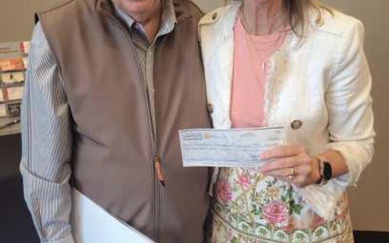 Jack Sculfort, Perrysburg Rotary Community Foundation executive director, presents a $10,000 Signature Sponsor check for America 250 to Joy Studer, Historic Perrysburg, Inc. board president.