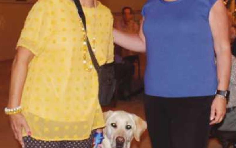 Dr. Anstadt, left, and Jenny Barlos, client services manager for the Ability Center’s assistance dogs program, with Granger, the new therapy dog for Washington Local Schools.