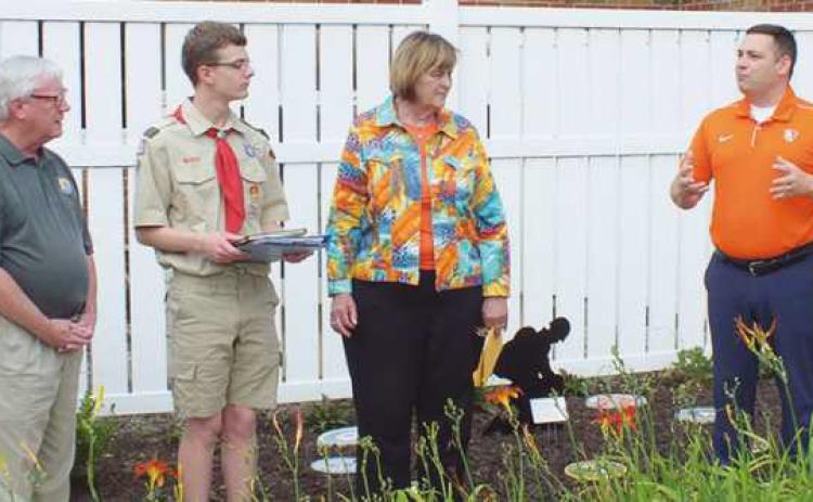 State Representative Haraz Ghanbari addresses, from left, Perrysburg city councilman Tim McCarthy, Eagle Scout David Lenz and Wood County Commissioner Doris Herringshaw.