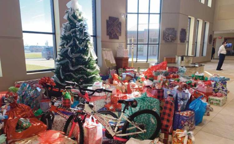 St. John XXIII parish’s St. Vincent de Paul Society members collected 435 wrapped packages and grocery store gift cards for people in need.