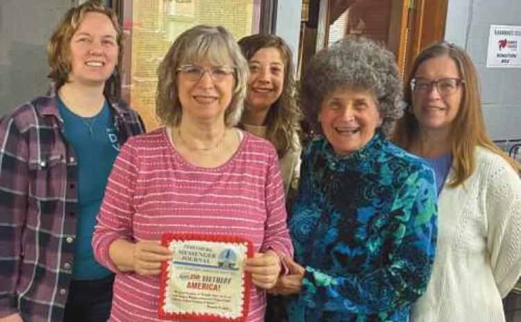 Welch Publishing Company staff with their contribution to the fiber arts project.