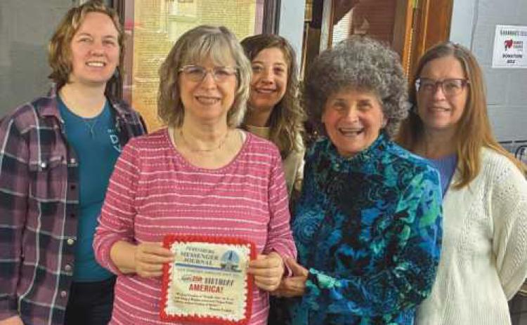 Welch Publishing Company staff with their contribution to the fiber arts project.