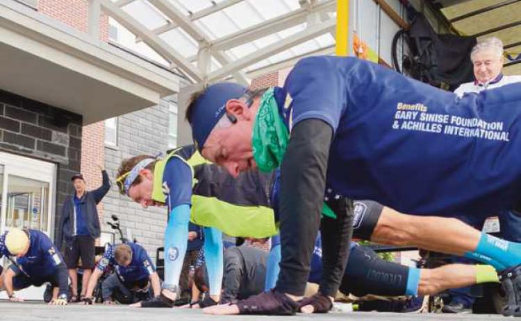 Before beginning each day’s trip, the U.S. Naval Academy Class of 1983 graduates perform 22 pushups, symbolizing the number of veterans who commit suicide each day.