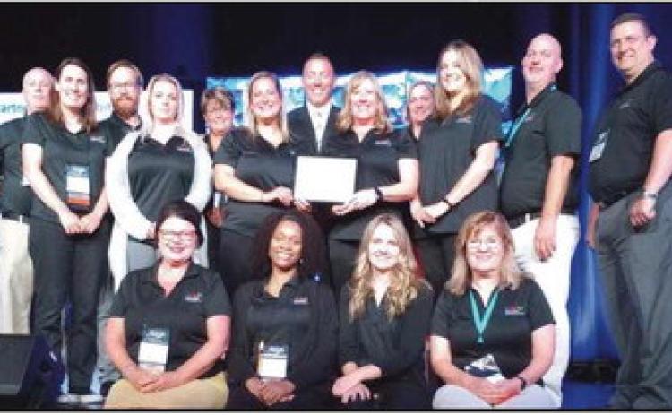 Penta staff and faculty celebrate their third Pacesetter School award.