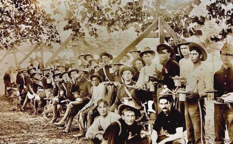 Murrell Redman, bottom right hand corner sitting, hatless with mustache, at Camp Poland, Tennessee, in the summer of 1898. Below, Perrysburg residents and cousins, John and George Hoffmann, served in the Philippines during the Spanish-American War.