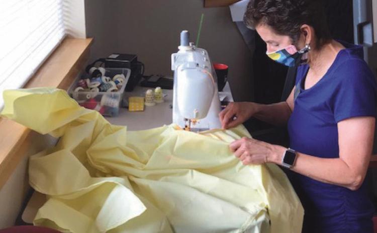 Mrs. Seibenick sews protective gowns for her staff during the pandemic’s initial stages when PPE was hard to find.