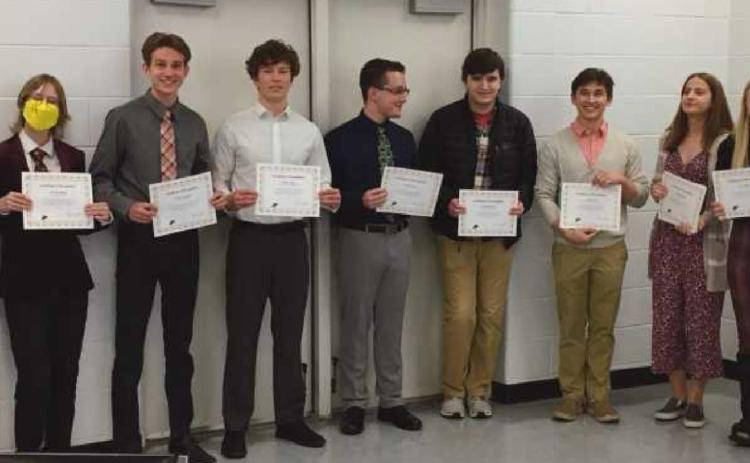 At the school board meeting, are from left: PHS Principal Aaron Cookson, and PHS seniors Karen Li, Emmett Bohney, Nathan Thompson, Nathan Stepp, Michael Brown, Grant Knowlton, Owen Laib, Lauren Sandberg, Jenna Rettig and Lindsey Lazor, with school board member Lori Reffert.