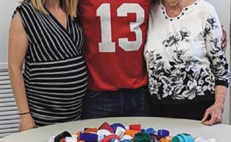 From left: Jessi Chapman, Perrysburg Area Senior Center site manager; Bruno Rivera, who collected the most lids, and Connie Stallter, organizer of the project.