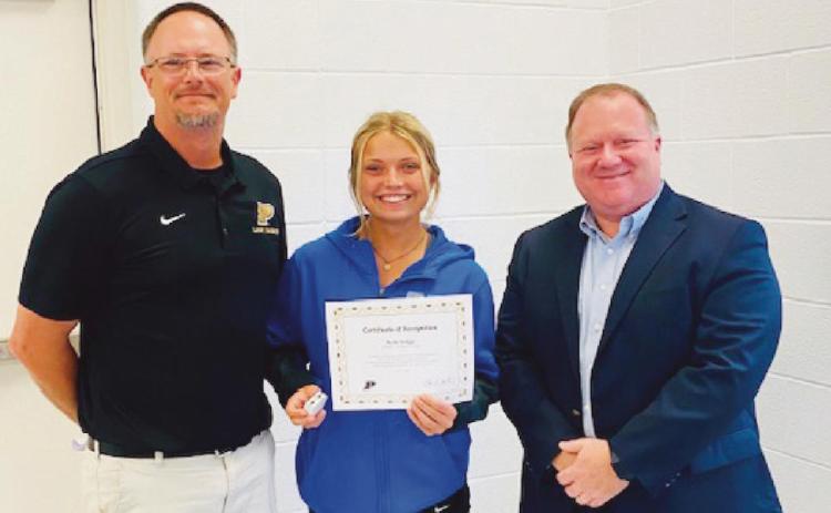 From left, Ryan DeMars, head softball coach; Kylie Griggs, First Team All-State; and Eric Benington, school board member.
