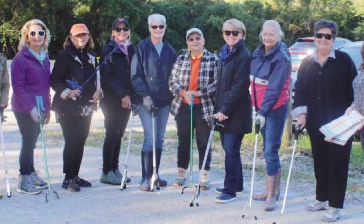 Lauren Rush, stormwater coordinator for the City of Perrysburg, far right, with Country Garden Club volunteers, from left, Kim Frazier, CGC conservation committee chair; Bonnie Ash; Judy Reitzel; Karen Hinkson, Holiday Trunk Show co chair; Pat Smith; Ursula Kluge; Jan Connors; Michele Alexander and Annette Sipp.