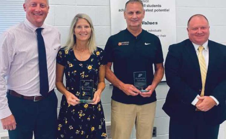 Two school staff members were honored upon their retirements by the school board. They are Lisa Wagner, PHS science teacher from 1991 to 2022, and Dave Boyce, PHS assistant principal, teacher and coach from 2000 to 2022. With them are PHS principal Aaron Cookson, far left, and board president Eric Benington, far right. Not pictured is Rebecca McKinney, bus driver and transportation department staff from 1993 to 2022.