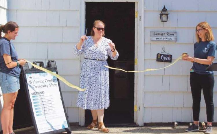 Executive director Heather Gallant opens the new Welcome Center and Curiosity Shop. At right, pottery and other items are featured in the new center.