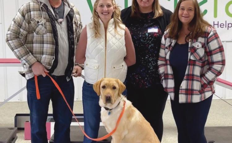 Taft, on his last day of training, with, from left, his host away from school, John Henline, teacher and assistant athletic director; and his handlers at school, Janice Ray, dean of students, Sadie Browne, intervention specialist, and Alana Sigg, counselor.