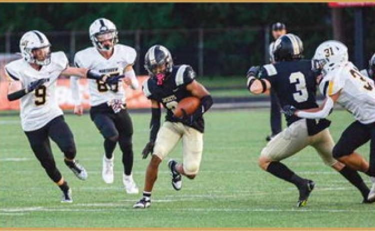 Dominick Woods finds an opening and skirts past Northview defenders.