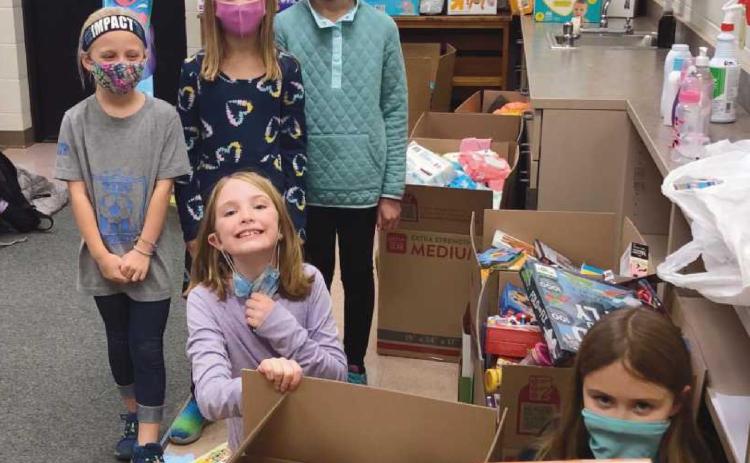 Toth Elementary students Lucy Crumbaugh, Jillian Allesee, Clara Humphrey, Sullie Morrison and Morgan Fornwald held a drive to support Mom’s House. They collected more than 1,400 items.
