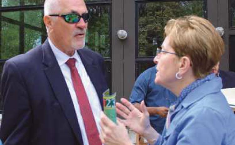 Congresswoman Marcy Kaptur discusses with Rex Huffman, Wood County Port Authority, funding for a proposed pedestrian/bike path bridge spanning the Maumee River and connecting Lucas and Wood counties’ trail systems.