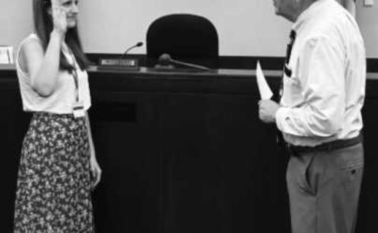 Oath of office on September 1 at Wood County Juvenile Court, from left: CASA volunteer Jessica Wente of Perrysburg with Judge David Woessner.