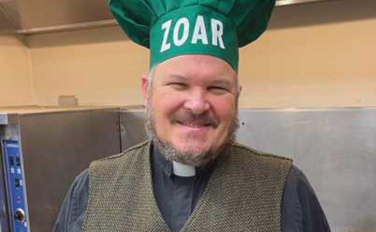 Zoar Pastor Paul Reichert helps at a recent Kitchen of Hope dinner.
