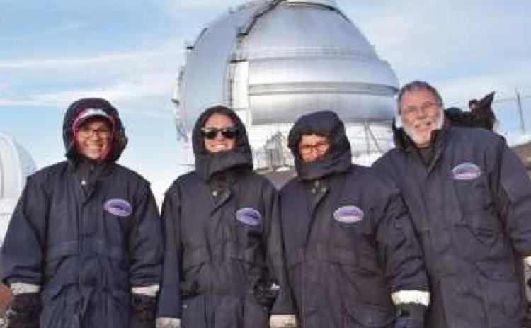Judy Hagen, second from right, with her husband James and daughters Ali and Liz, submitted this Journal Reader photograph at Mauna Kea observatory during a family trip to Hawaii a number of years ago. At the observatory, they enjoyed stargazing and viewed the glow of the lava from the active volcano on the Big Island.