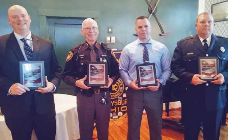 From left are PHS school resource officer Greg Cole, Wood County Sheriff’s Auxiliary Deputy Hobart Johnson, township police officer Ryan Welch and township firefighter Wesley Waggoner. Another recipient, Perrysburg Fire Division firefighter Justin Lynch, was not present for the ceremony.