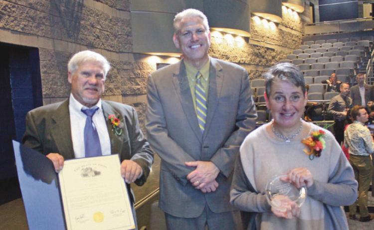 Flanking Perrysburg Superintendent Tom Hosler, center, are the Penta 2022 Outstanding Alumni and PHS graduates James Henry and Christy Armstrong.